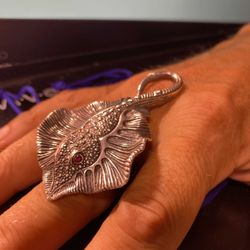 Kaya - The eyes are rubies. The ring is made of sterling silver. A really nice weight on your hand.