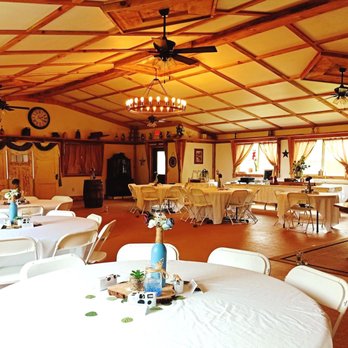 Wagon Wheel Event Center at WagonMaster - setup for intimate indoor ceremony - Party & Event Planning Near Me - Murphy, North Carolina Wagon Wheel Event Center at WagonMaster - setup for intimate indoor ceremony - Party & Event Planning Near Me - Murphy, North Carolina