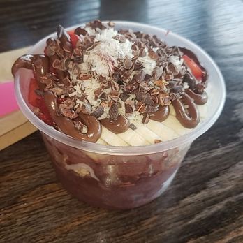 Acai Paradise - Romantic Daze Acai Bowl (Acai sorbet, coconut oil, granola, banana, strawberry, cacao nibs, nutella and coconut flakes) - American Near Me - Tucson, Arizona Acai Paradise - Romantic Daze Acai Bowl (Acai sorbet, coconut oil, granola, banana, strawberry, cacao nibs, nutella and coconut flakes) - American Near Me - Tucson, Arizona