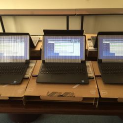 B&C IT Solutions - Configuring multiple laptops for a business. These are new laptops that we are installing all the software they will be using.