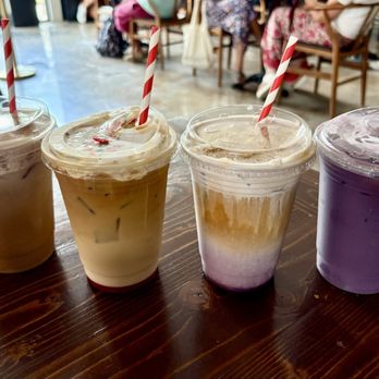 Pavón Coffee Den - Iced vanilla latte with banana crema on top, iced fruity pebble latte, iced blueberry pie latte, & iced ube latte - Coffee & Tea Near Me - Houston, Texas Pavón Coffee Den - Iced vanilla latte with banana crema on top, iced fruity pebble latte, iced blueberry pie latte, & iced ube latte - Coffee & Tea Near Me - Houston, Texas