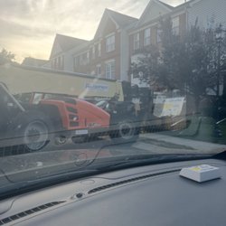 NV Roofing - Parked in the street with the bucket on my lawn (ez pass reflection hiding their makeshift wooden bucket)