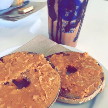 Flour Garden Bakery - Banana nut bagel with peanut butter on top and vegan blast espresso blended with coconut milk and chocolate drizzle - Bakeries Near Me - Auburn, California Flour Garden Bakery - Banana nut bagel with peanut butter on top and vegan blast espresso blended with coconut milk and chocolate drizzle - Bakeries Near Me - Auburn, California