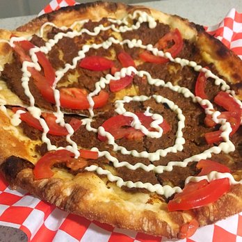 Man'oushe Express - Sujuk Flatbread - spicy beef sausage, tomato, garlic aioli - Pizza Near Me - Seattle, Washington Man'oushe Express - Sujuk Flatbread - spicy beef sausage, tomato, garlic aioli - Pizza Near Me - Seattle, Washington