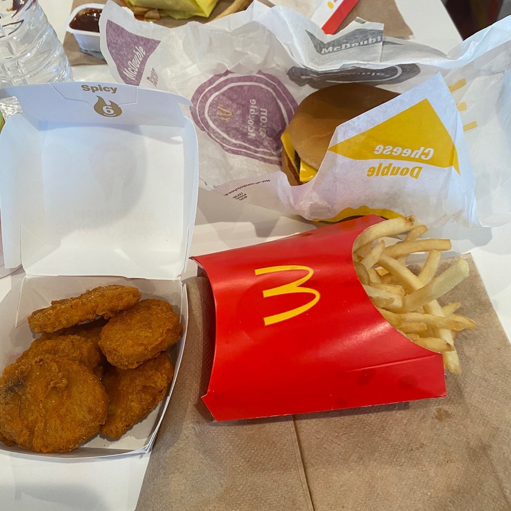 chicken nuggies and fries on a table