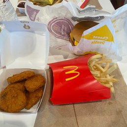 chicken nuggies and fries on a table