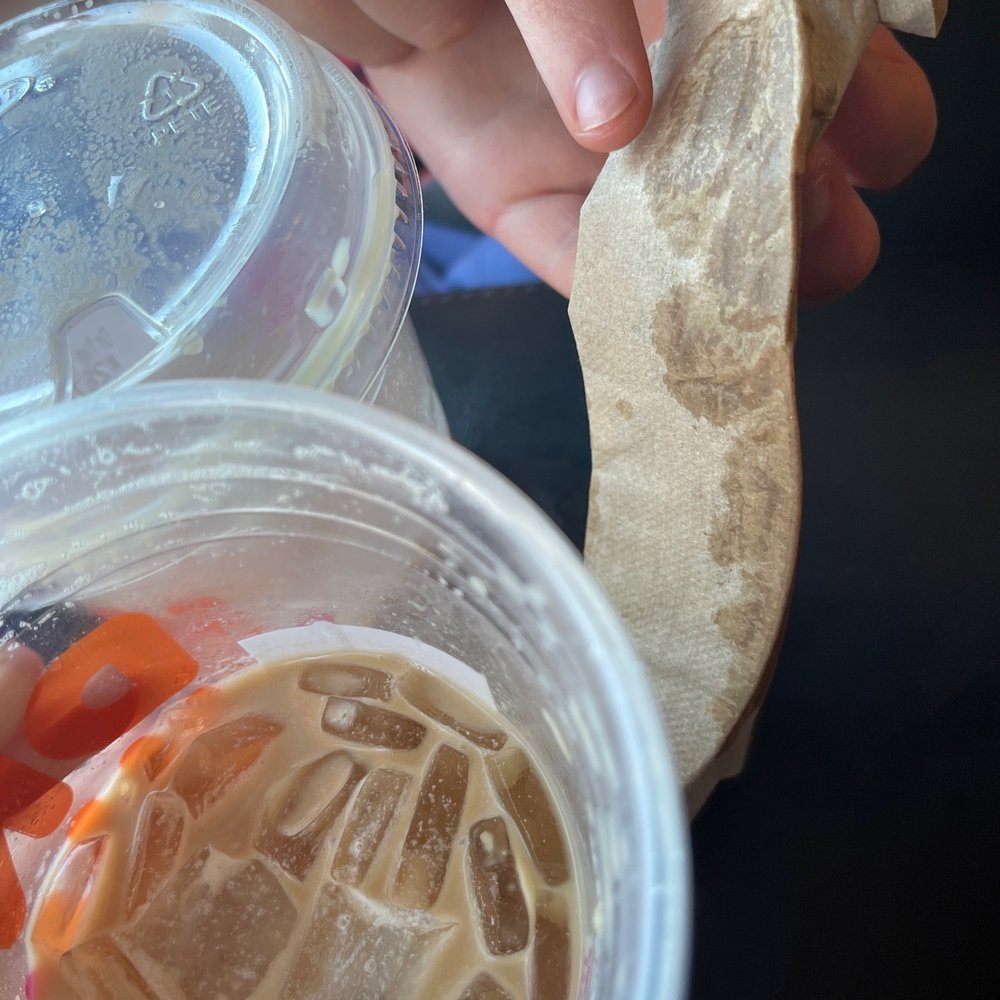 Dunkin' - a person holding a sandwich in their hand - Donuts Near Me - Duluth, Minnesota Dunkin' - a person holding a sandwich in their hand - Donuts Near Me - Duluth, Minnesota