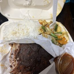 Ribs, Rice, Veggies, & BBQ sauce. Ribs, Rice, Veggies, & BBQ sauce.