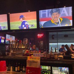a baseball game being played on tvs a baseball game being played on tvs