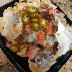 Del Taco - Del Taco's Queso Nachos (used to be called Macho Nachos).. White cheese just doesn't cut it, bring back the gooey orange nacho cheese!