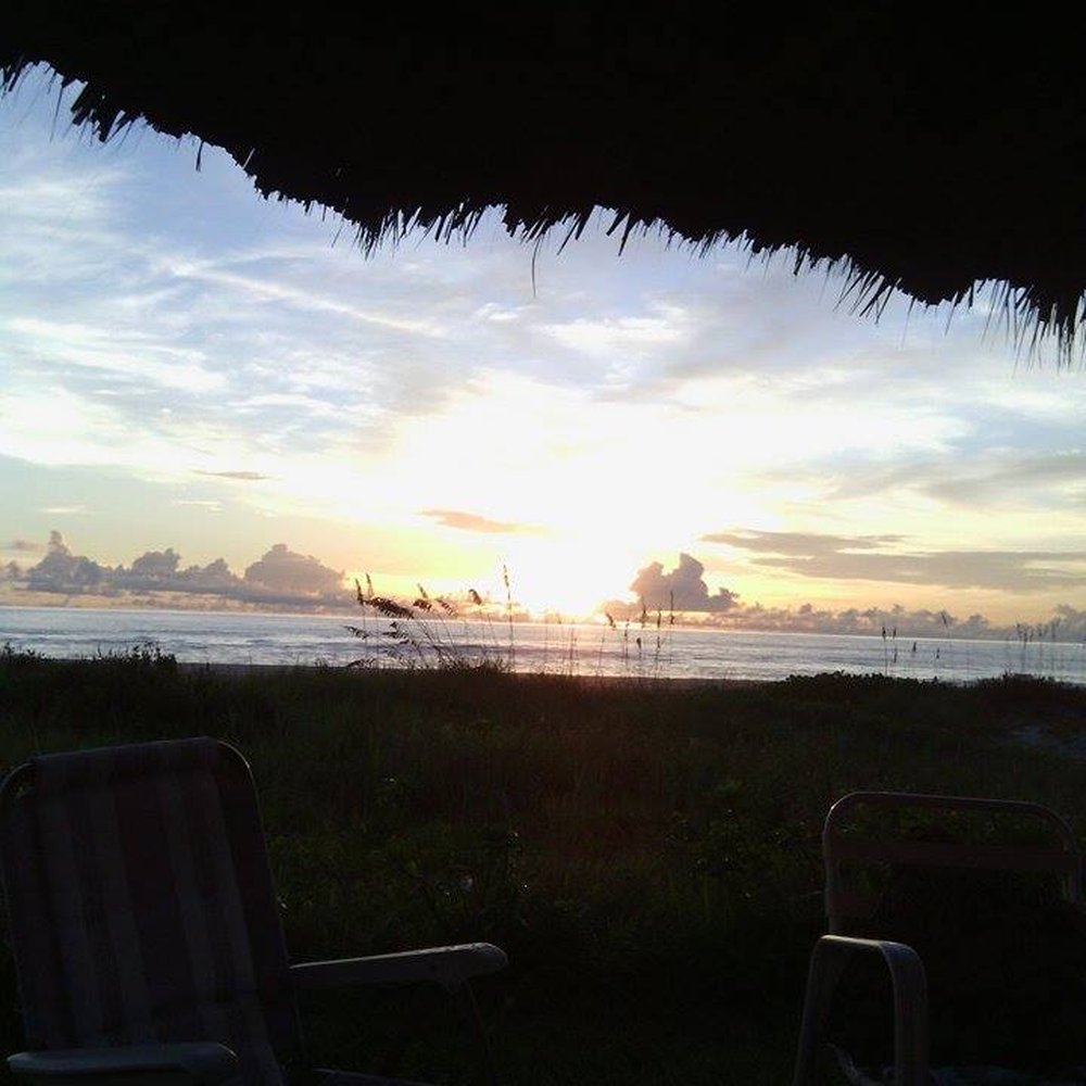 South Beach Inn - Sitting on a chair enjoying the sun rise. - Hotels Near Me - Cocoa Beach, Florida South Beach Inn - Sitting on a chair enjoying the sun rise. - Hotels Near Me - Cocoa Beach, Florida