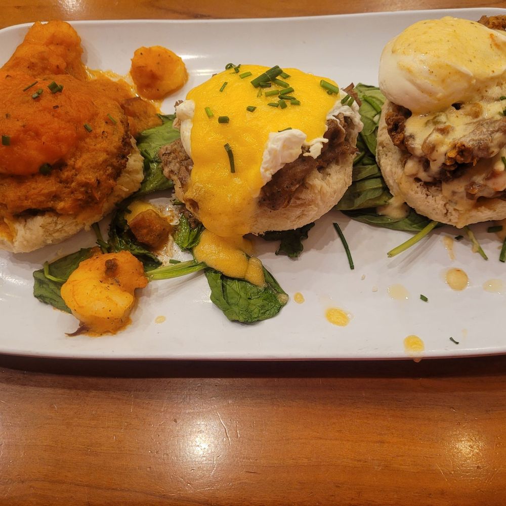Ruby Slipper Decatur - Trifecta Benedict: L - shrimp, C - pork, R - chicken - Breakfast & Brunch Near Me - New Orleans, Louisiana Ruby Slipper Decatur - Trifecta Benedict: L - shrimp, C - pork, R - chicken - Breakfast & Brunch Near Me - New Orleans, Louisiana