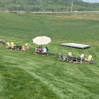 Early Mountain Vineyards - Picnic tables and seating on the grass - Wineries Near Me - Madison, Virginia