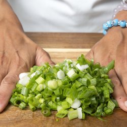 Photo by Cozymeal.  Chopped green onions.