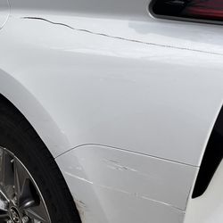 Dents No More Paintless Dent and Bumper Repair - Back bumper was scraped in parking lot.