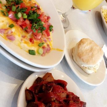 Elmo's Diner - South western grits with breakfast potatoes and a biscuit...oh and of course breakfast is incomplete without a mimosa! - Diners Near Me - Durham, North Carolina Elmo's Diner - South western grits with breakfast potatoes and a biscuit...oh and of course breakfast is incomplete without a mimosa! - Diners Near Me - Durham, North Carolina