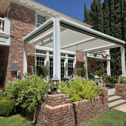 Southwestern Home Products - Motorized pergola with solar shades heaters fan and LED light kit. All automated via app.