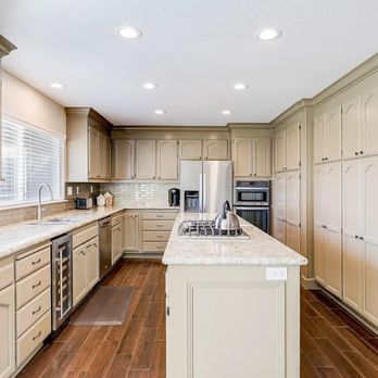 DC Tile and Stone - a large kitchen with a center island - General Contractors Near Me