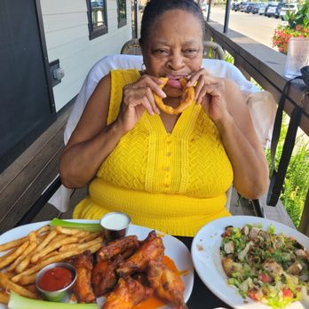 The Dock on Front - Mom eating onion rings - American Near Me - Mokena, Illinois
