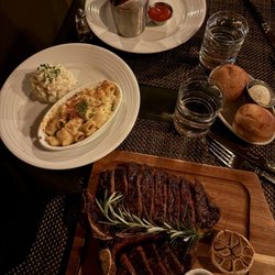 Porterhouse steak, mac and cheese, mash potatoes, French fries, and mushrooms
