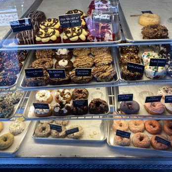 Hurt's Donut - a variety of donuts in a display case - Donuts Near Me - Cedar Falls, Iowa