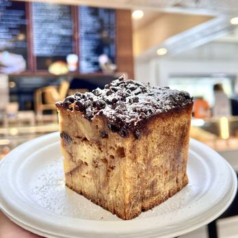 Parfait Paris - French Pudding. Dense croissant with layers of chocolate, cinnamon, pecan, & caramel. Chocolate chips & powdered sugar sprinkled on top. - Creperies Near Me - Anaheim, California Parfait Paris - French Pudding. Dense croissant with layers of chocolate, cinnamon, pecan, & caramel. Chocolate chips & powdered sugar sprinkled on top. - Creperies Near Me - Anaheim, California