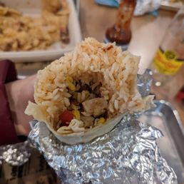 a burrito wrapped in tin foil a burrito wrapped in tin foil