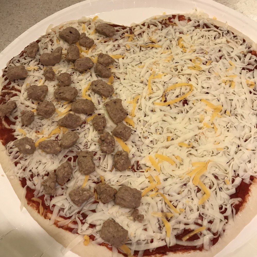 Domino's Pizza - an uncooked pizza on a paper plate - Pizza Near Me - Firestone, Colorado Domino's Pizza - an uncooked pizza on a paper plate - Pizza Near Me - Firestone, Colorado
