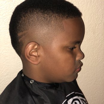 FadeZone Barbers - Kid Mohawk with simple design - Barbers Near Me - Edmond, Oklahoma FadeZone Barbers - Kid Mohawk with simple design - Barbers Near Me - Edmond, Oklahoma