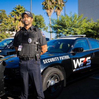 Wolfpack Protective Services - Wolfpack Protective Services guard with one of our patrol vehicles. - Security Services Near Me - Reseda, California