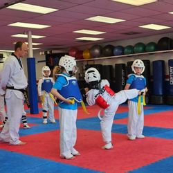 The Rock Martial Arts & Fitness - My daughter practicing her front leg round house kicks while Master Prueitt watches