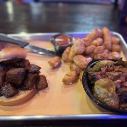 BBQ'd Productions - Burnt end sandwich, bacon brussel sprouts, and appetizer of cheese curds.