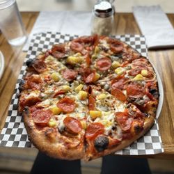 Gil's Goods - Gil's supreme pizza with pineapple and jalapeño