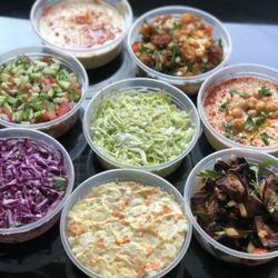 Ba Shuk - Hummus ,babaganush ,fried eggplant, red slaw, Israeli chopped salad, fried cauliflower, potatoes salad, green cabbage with dill.