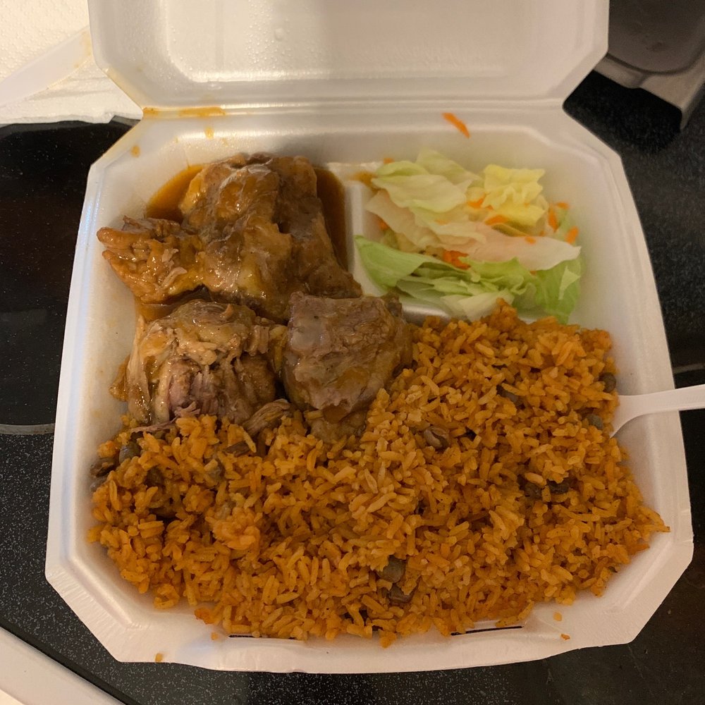 Yellow rice with pigeon peas and 3 pieces of oxtail. Yellow rice with pigeon peas and 3 pieces of oxtail.
