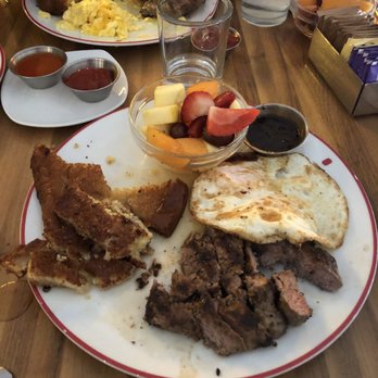 MoCo's Founding Farmers - NY Strip Steak French Toast over medium eggs and fruit (2 egg breakfast) - New American Near Me - Potomac, Maryland MoCo's Founding Farmers - NY Strip Steak French Toast over medium eggs and fruit (2 egg breakfast) - New American Near Me - Potomac, Maryland