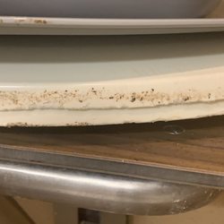Chateau Living Center - Dirty toilet seats the staff stored in my parent's shower at Chateau Living Center in Kenner, Louisiana.