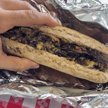 West Cuisine - Herring with bread, seems to have some cabbage in there, this item reminded me of German food. - Restaurants Near Me - Brooklyn, New York