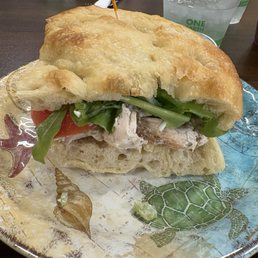 Chicken salad sandwich on fresh warmed focaccia bread Chicken salad sandwich on fresh warmed focaccia bread