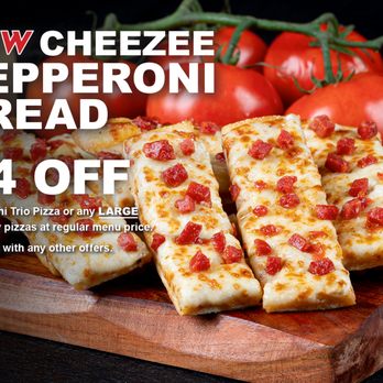 Pizza Guys - a wooden cutting board with slices of pizza on it - Pizza Near Me - Lodi, California