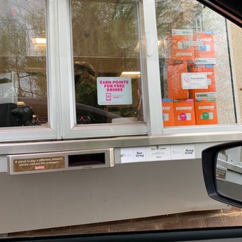 Dunkin' -  a window with a sign in it - Coffee & Tea Near Me - Manalapan, New Jersey