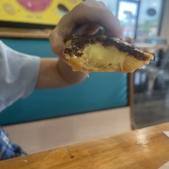 Daily Donuts - Eclair donut! Soooo fresh with so much filling! - Bubble Tea Near Me - Orange Park, Florida
