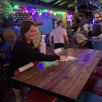 Tin Roof - a woman sitting at a table - Music Venues Near Me - Louisville, Kentucky Tin Roof - a woman sitting at a table - Music Venues Near Me - Louisville, Kentucky