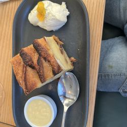 The Castle - This is a dessert that is vanilla bread and also butter pudding on the side and non sweet whip cream to add on.