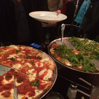 Juliana's - Margherita with half pepperoni and half garlic, and kalamta olives and arugula - Pizza Near Me - Brooklyn, New York Juliana's - Margherita with half pepperoni and half garlic, and kalamta olives and arugula - Pizza Near Me - Brooklyn, New York