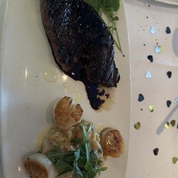 The Capital Grille - Porcini crusted ribeye and scalloped risotto - Steakhouses Near Me - Costa Mesa, California The Capital Grille - Porcini crusted ribeye and scalloped risotto - Steakhouses Near Me - Costa Mesa, California