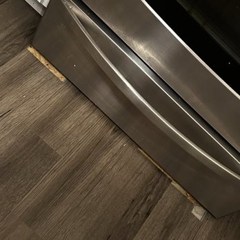 B&B Georgia Flooring - Flooring cut out around stove. - Flooring Near Me
