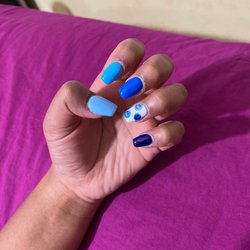 Five Star Nails Salon - full set of acrylic nails: coffin shape and with a design. $55 with student discount.