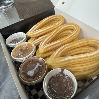 Ole Churros - 12 combo with cinnamon & sugar. Sauces: Nutella, strawberry, Spanish hot chocolate, and Dulce De Leche. - Spanish Near Me - Paradise, Nevada Ole Churros - 12 combo with cinnamon & sugar. Sauces: Nutella, strawberry, Spanish hot chocolate, and Dulce De Leche. - Spanish Near Me - Paradise, Nevada