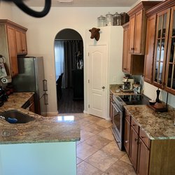 Jacksonville Countertops - Gorgeous granite counters in "Jaguar". (Odd aqua lighting?)